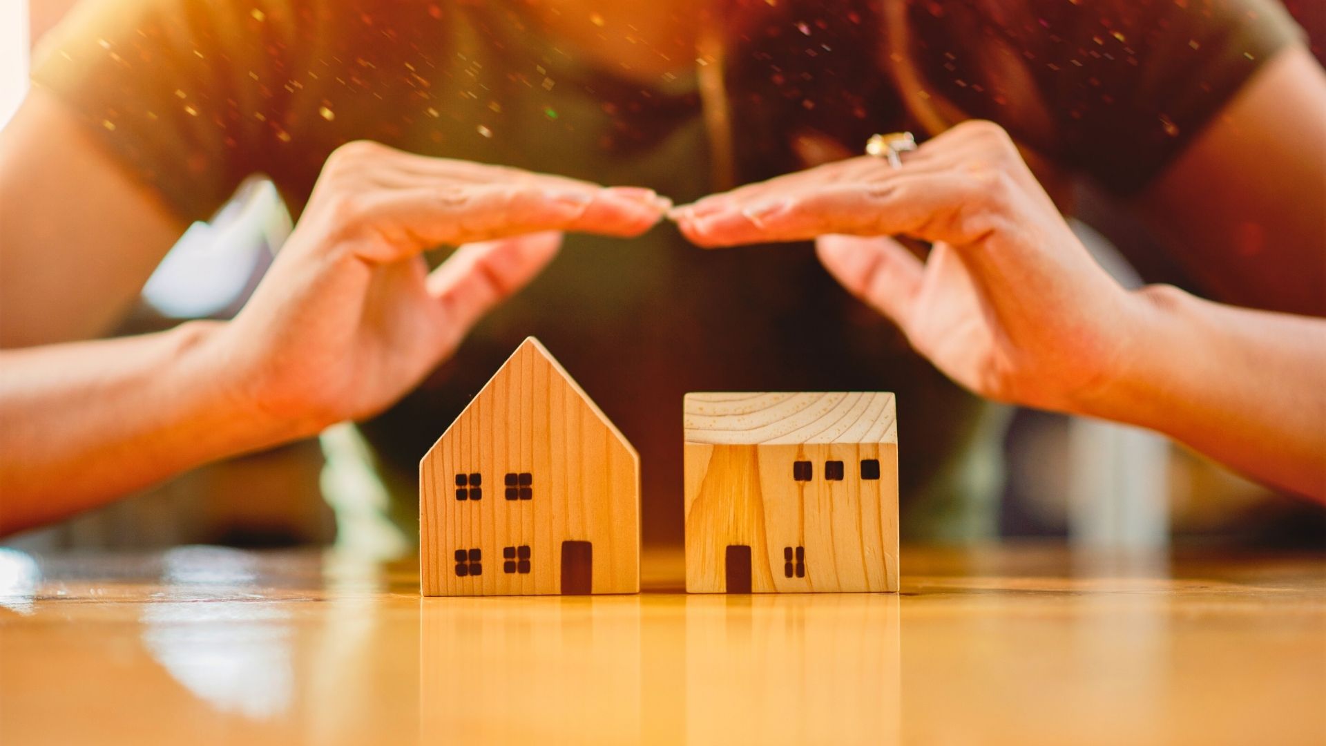 person shielding their home from negative sources for buying a home